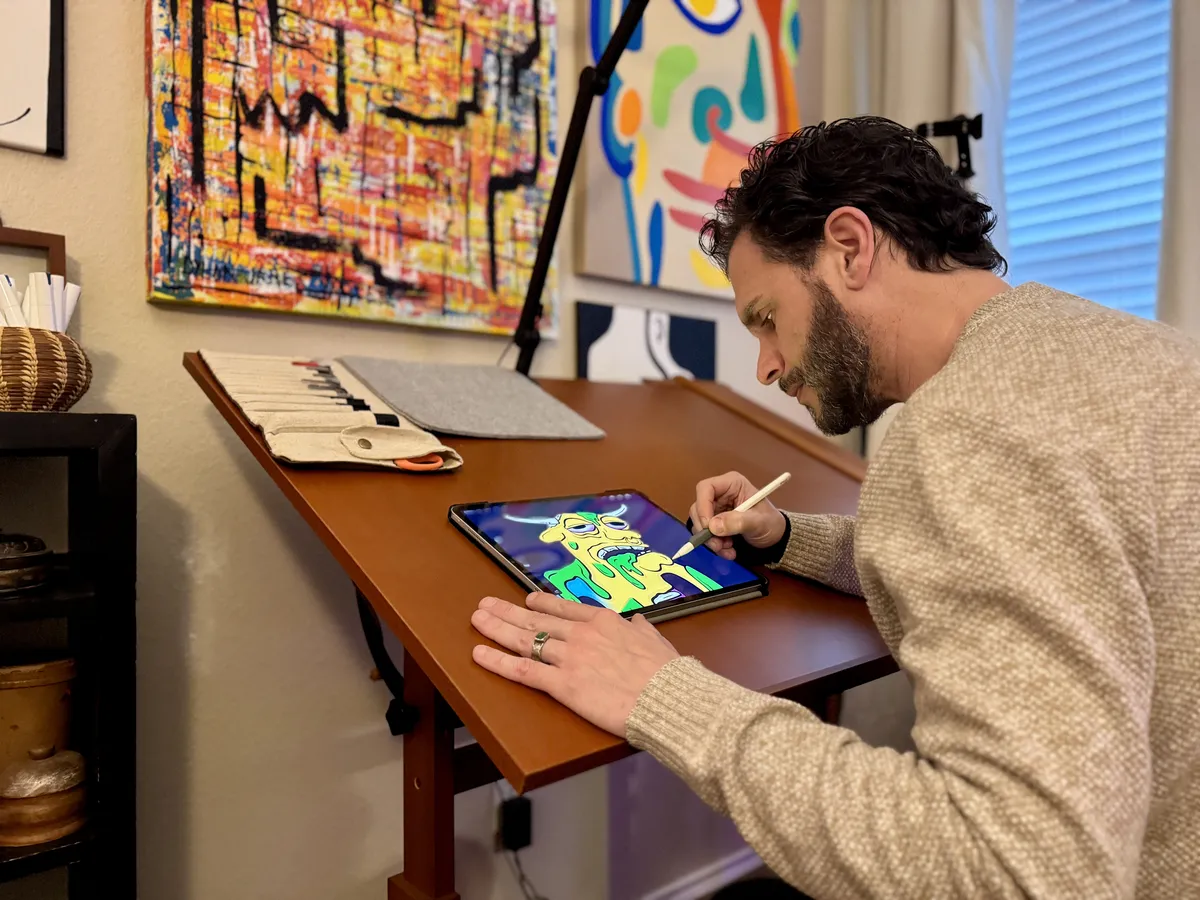 Dylan drawing BizarreBeasts characters in the studio.