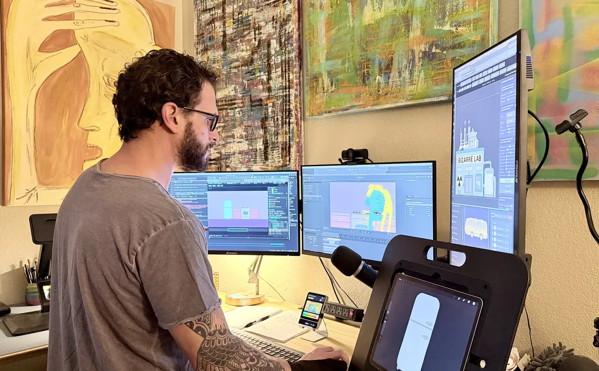 Dylan at the workstation where the series is animated.